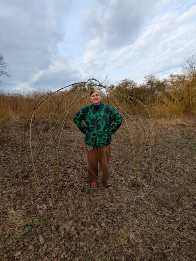 Willow weaver with handmade living willow structure